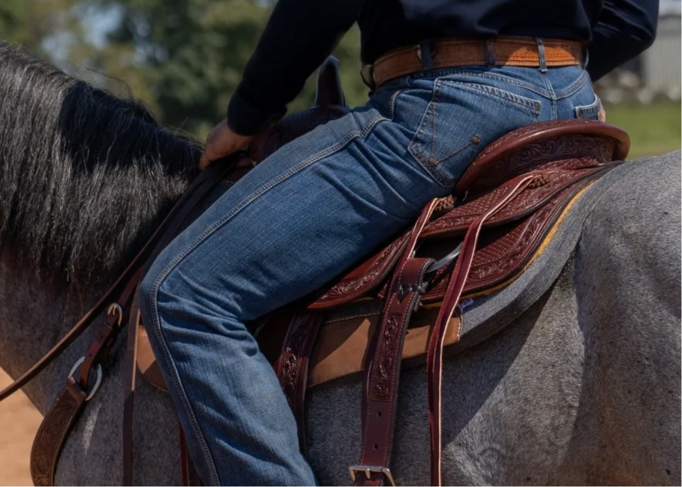 Person riding a horse with a dropdown menu on a website featuring the PRCA logo.